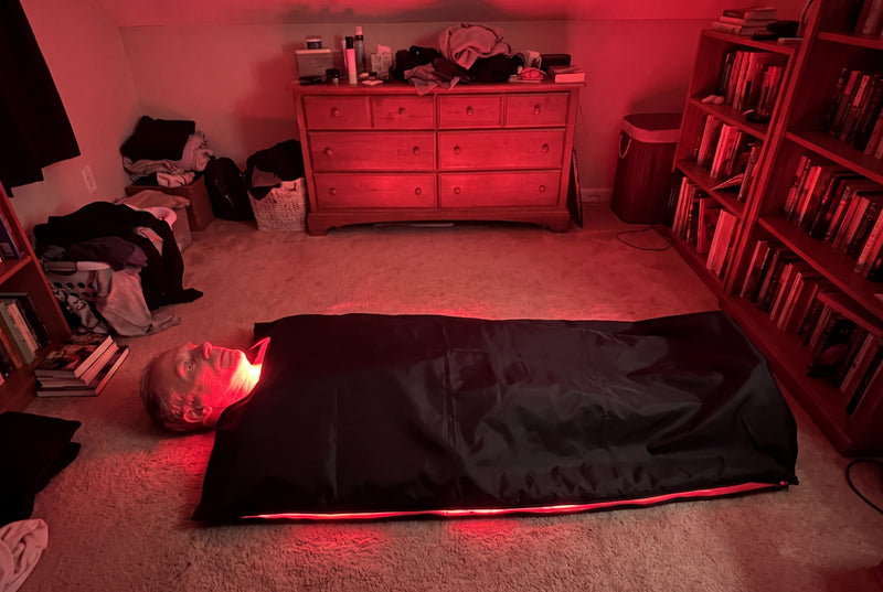 Man lying on the open Optimal Red Light Bag