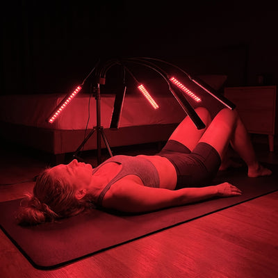 Customer on a yoga mat under the Red Light Lantern